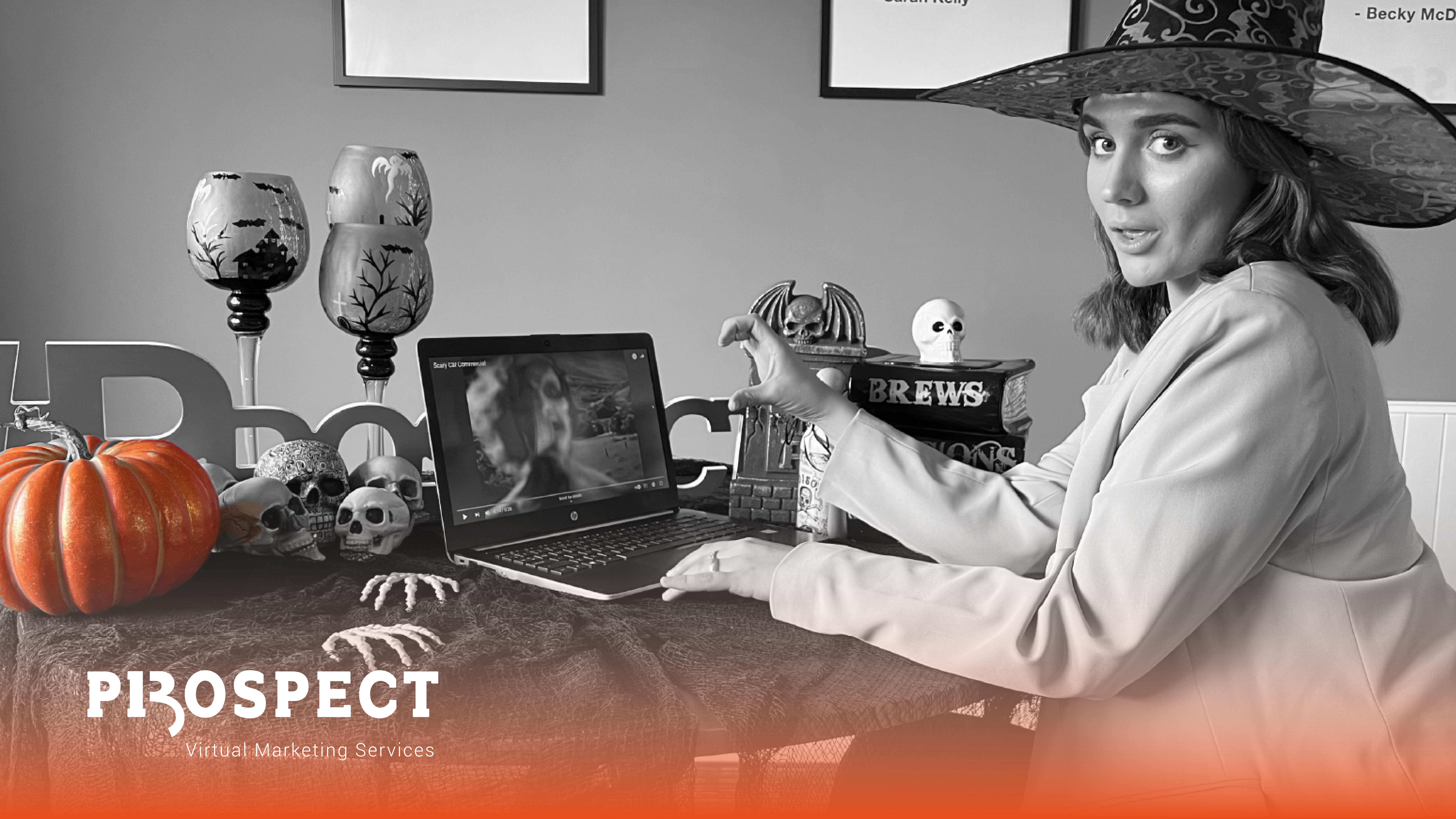 woman in halloween attire working on computer